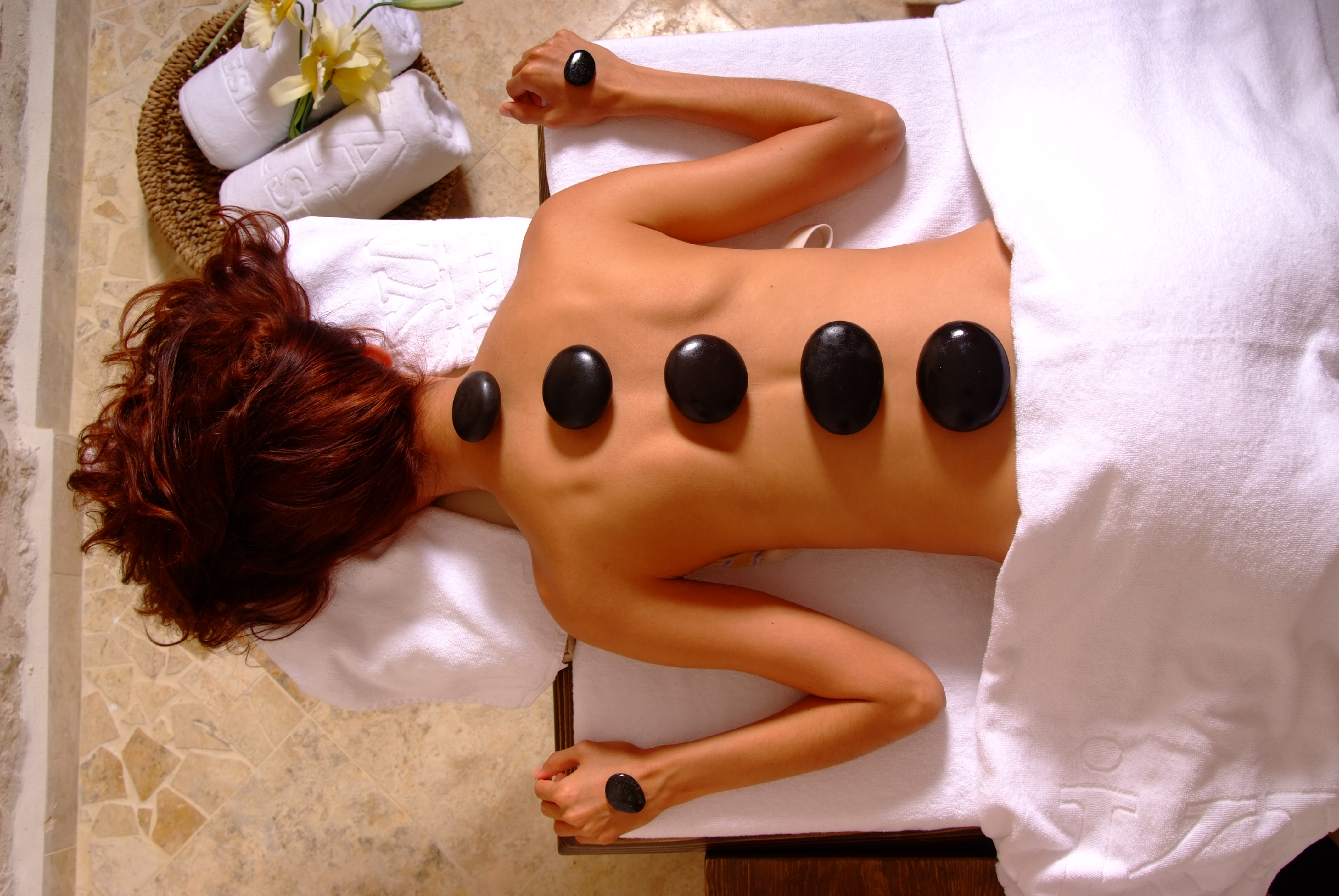 Arrange a hot stone massage