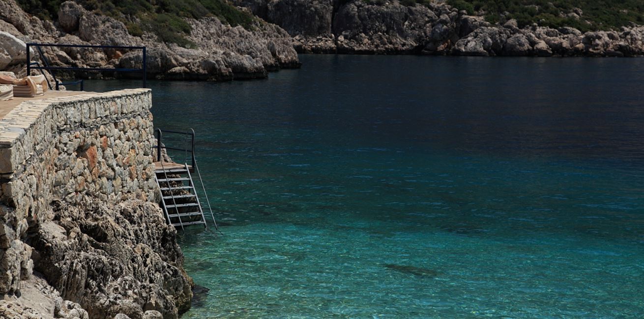 Steps into the clear blue water