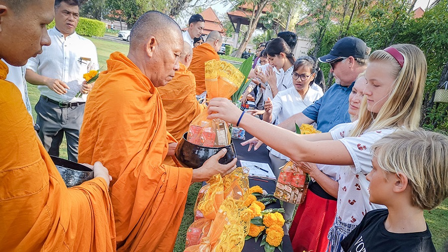 Giving alms to monks