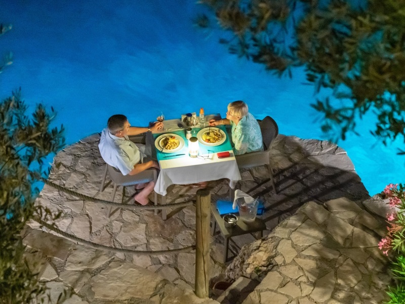 Evening dining by the water at Villa Mahal